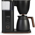 Black coffee maker with digital display on a white background
