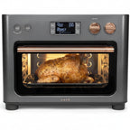 Café toaster oven with a roasted chicken inside on a white background